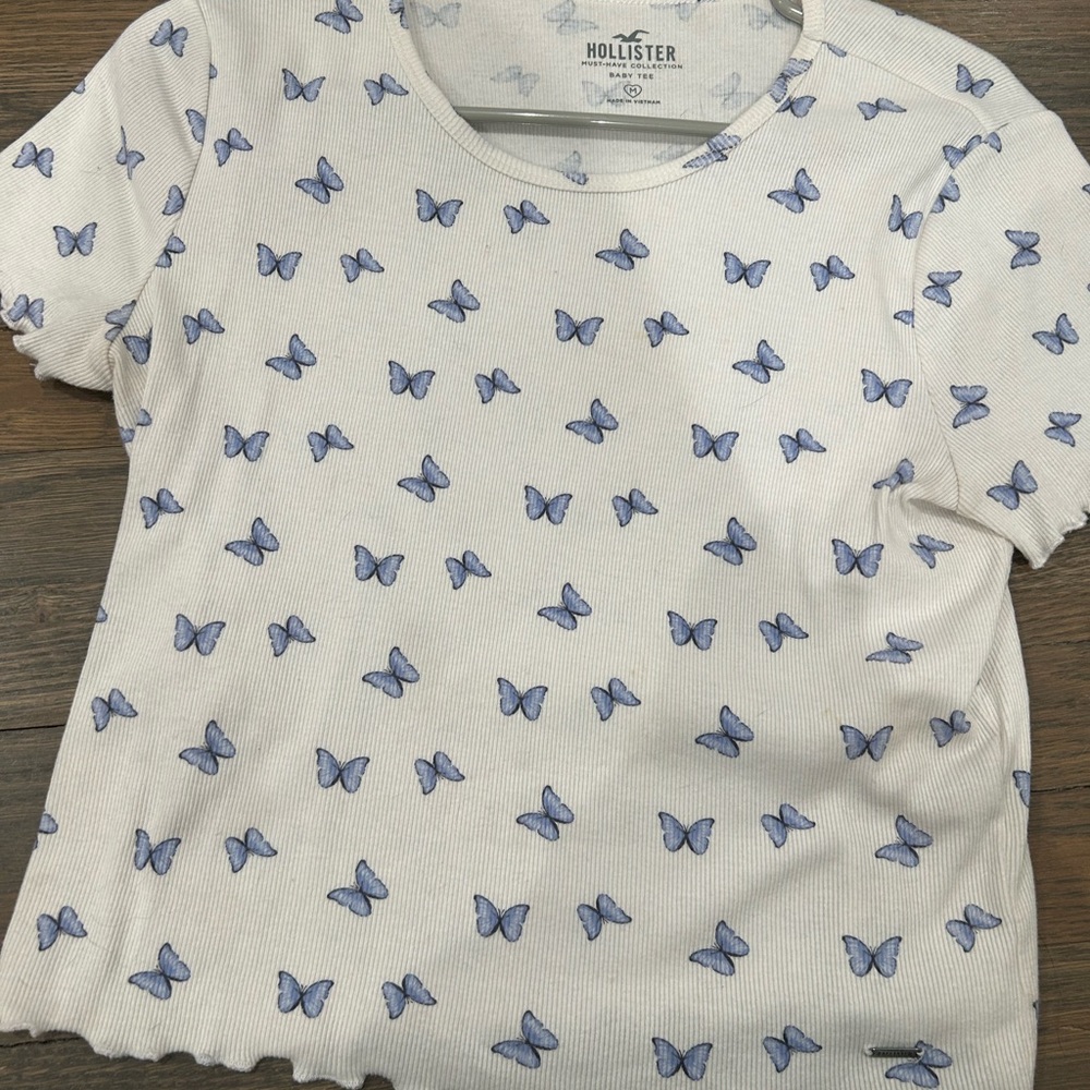 Hollister White Tee with Blue Butterfly Design